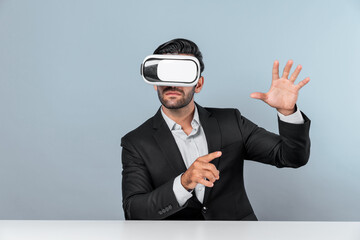 Smart businessman sitting while pointing and choosing data analysis by using technology innovation. Professional caucasian project manager using virtual reality glasses and VR goggles. Deviation.