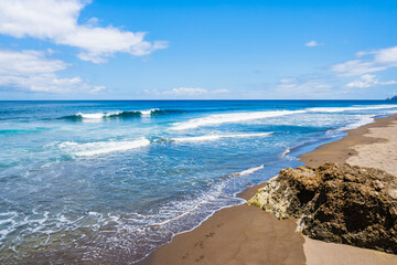 Wall Mural - Idyllic Saota Barbara beach with black sand and ocean waves near Ribeira Grande town, Sao Miguel island, Azores, Portugal