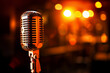 © Максим Коробский - a microphone is sitting in front of a blurred background of lights