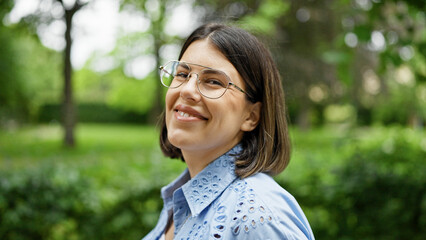 Poster - Young beautiful hispanic woman walking smiling at the park in Vienna