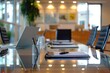 © Fotograf - A glass table with a laptop and pen, ideal for workspace or studying