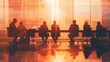 © vixion - Silhouettes of Businesspeople in Meeting Room Looking at Sunset