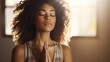 © ittipol - Close-up of a Black woman practicing yoga with her eyes closed and hands in prayer position, wearing comfortable yoga attire, in a bright studio with natural light,generative ai