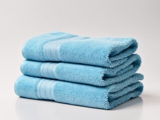 Neatly folded blue towel isolated on white background.