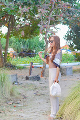 cute girl enjoying time outdoor at white sand beach