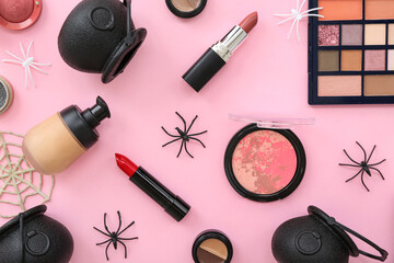 Wall Mural - Composition with different makeup products and Halloween decor on pink background