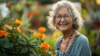 © Boomanoid - Senior woman smiling in a flower garden