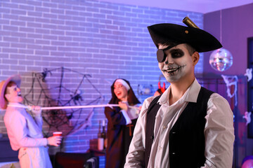 Canvas Print - Young man dressed as pirate at Halloween party