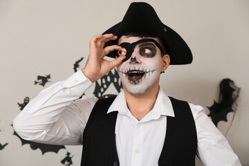 Canvas Print - Young man dressed as pirate at Halloween party, closeup