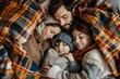 © Iftikhar alam - Father and kids nestled closely together, peacefully asleep under a cozy plaid blanket, Family snuggled together under a plaid blanket