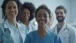 © Tahir AI - Smiling group of medical workers posing in a clinic, representing different backgrounds.