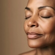 © SOLDATOOFF - A middle-aged African American woman with closed eyes looks serene, emphasizing the importance of skincare