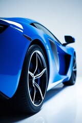 Poster - Perspective low-angle view of a blue sports car in studio setting