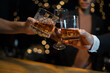 © aekachai - Celebrate whiskey on a friendly party in  restaurant