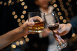 © aekachai - Celebrate whiskey on a friendly party in restaurant