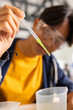© wavebreak3 - In high school, teenager using pipette for science experiment in classroom