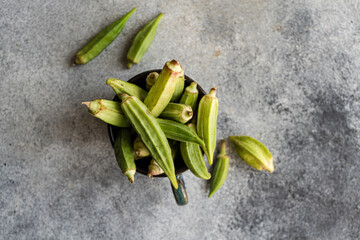 Raw bamia or okra vegetable cooking