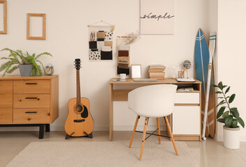 Sticker - Interior of teenager's room with workplace, organizers and surfboard