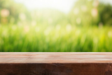 Poster - Empty wooden table top showing blurred green nature background for product display