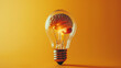 © paco - Lightbulb with brain inside symbolizing creativity and innovative thinking, isolated on yellow background