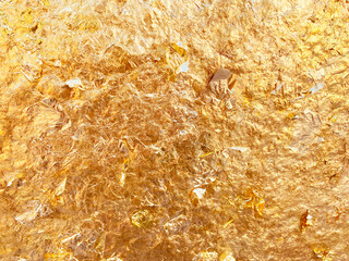 Texture of the gold leaf, Gold background, Picture from Buddha image Back