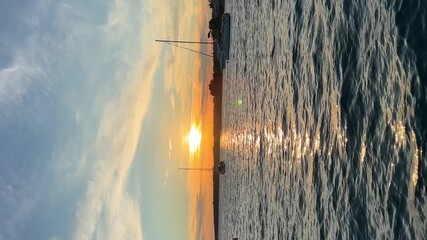 Wall Mural - Yachts moored on buoys near the shore in the bay of Uvala Gradina near the town of Vela Luka on the island of Korcula at sunset lights in Croatia