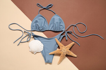 Sticker - Beautiful swimsuit, starfish and seashell on color background, flat lay