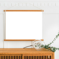 Wall Mural - Blank frame mockup hanging above a wooden cabinet