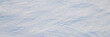 © Andrei Stepanov - Beautiful winter background with snowy ground. Natural snow texture. Wind sculpted patterns on snow surface. Wide panoramic texture for background and design.