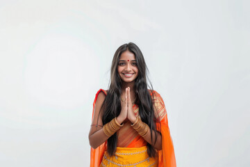 Wall Mural - indian woman giving namaste on white background