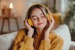 © ttonaorh - panoramic shot of young woman in headphones listening music at home
