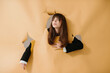© dsheremeta - Fashion photo, young pretty woman posing on torn beige background.