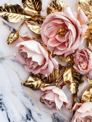 Wall Mural - Elegant arrangement of pink roses with golden leaves on a marble background. The luxurious and artistic setup exudes a sense of romance and sophistication.