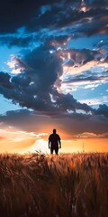 Poster - Silhouette of a Man Standing in a Field at Sunset