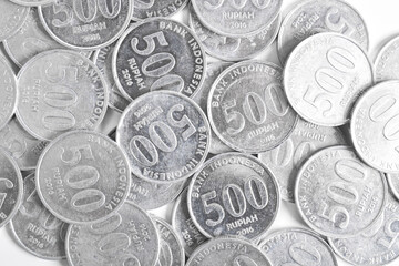 Stack of 500 rupiah coins on white background. National currency. Indonesian rupiah coin. Top view