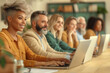 © SnapVault - A diverse group of middle-aged professionals, working on laptops in a modern office setting. individuals of various ethnic backgrounds, teamwork and inclusivity in a professional environment.