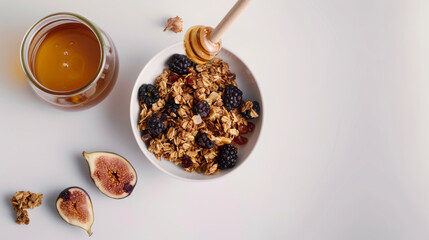 Sticker - A bowl of granola complemented with figs, blackberries, and honey showcases a fresh and natural breakfast spread.