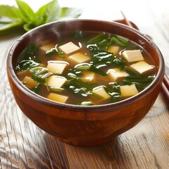 Canvas Print - a bowl of soup with tofu and spinach