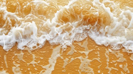 Wall Mural - Golden sand and sea foam on beach background Plenty of space for copy