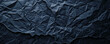 © Volodymyr - Dark navy blue background with a crumpled paper texture, adding depth and interest to the plain color.