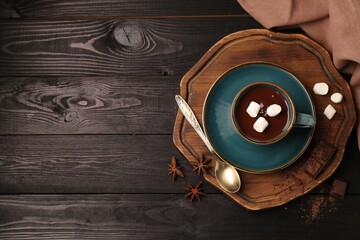 Sticker - Tasty melted chocolate with marshmallows in cup and anise stars on dark wooden table, flat lay. Space for text