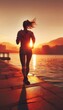 © osmanpek - woman jogging at sunset