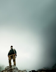 Canvas Print - Sky space, rock or man hiking in outdoor adventure or journey in nature for travel or walking. Low angle, view mockup and hiker on mountain peak for holiday vacation, exercise or trekking to explore