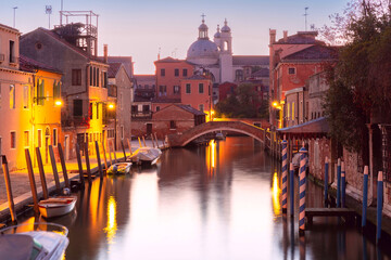 Wall Mural - Typical Venetian canal with bridge and church in the early morning, Dorsoduro, Venice, Italy