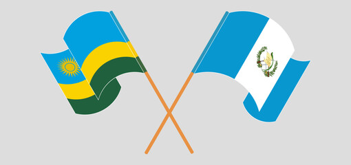 Wall Mural - Crossed and waving flags of Rwanda and Republic of Guatemala