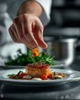 © Irina Ukrainets - Chef's hand garnishing a gourmet dish with herbs on a plate. Culinary concept. Detailed food photography in a professional kitchen setting. Perfect image for cooking websites and menus. AI