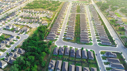 master planned community east of san antonio, row of new development two story houses in lush green 