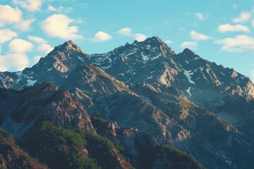 Wall Mural - The mountains are covered in snow and the sky is clear. The mountains are very tall and the snow is very white