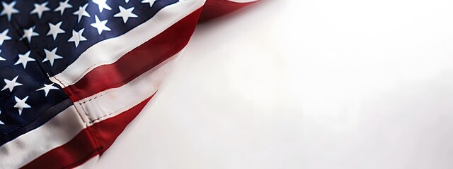 Wall Mural - A close up of the American flag, with its stars and stripes, symbolizing freedom and national pride. The background is white to emphasize the colors on the flag.