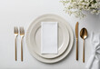 © All Creative Lines - Elegant dining table setting with blank white menu mockup laying on plate. Restaurant napkin invitation card template with copy space for weddings, romantic dinner